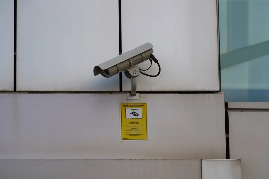 Security camera mounted on the wall of a building