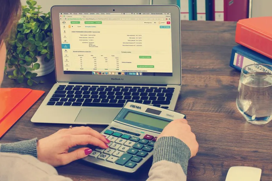 Calculator and financial paperwork on a desk